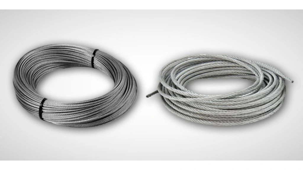 Coiled bundles comparing the material surface finishes of galvanised wire rope and stainless steel wire rope strands.